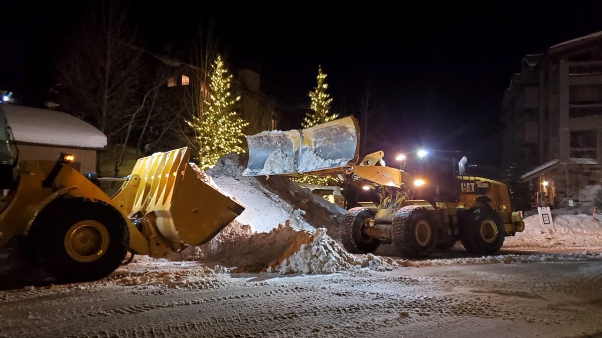 Heavy Machinery being used to facilitate snow hauling.