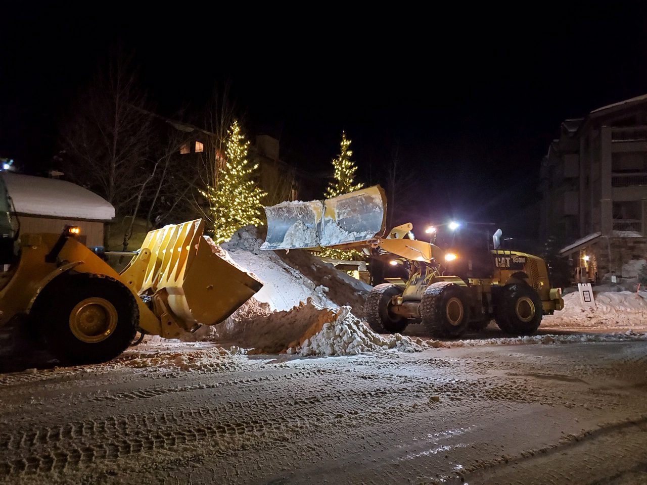 Heavy Machinery being used to facilitate snow hauling.