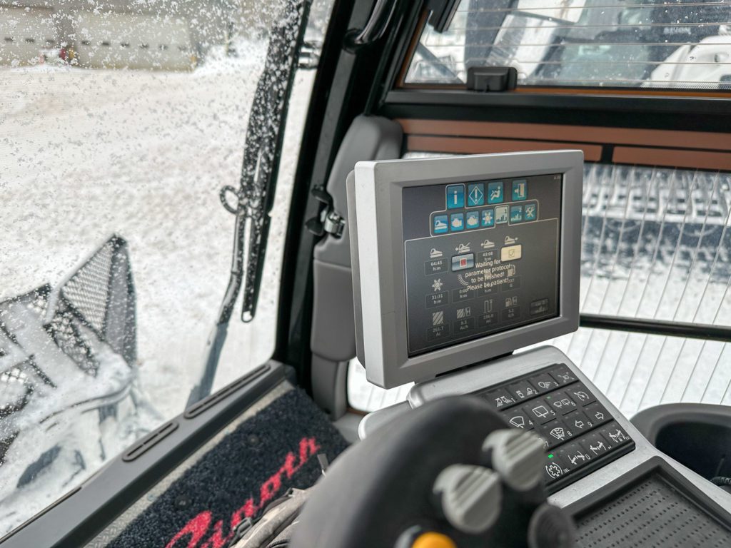 Control panel showing all the working parts of the snowcat that an operator can use.