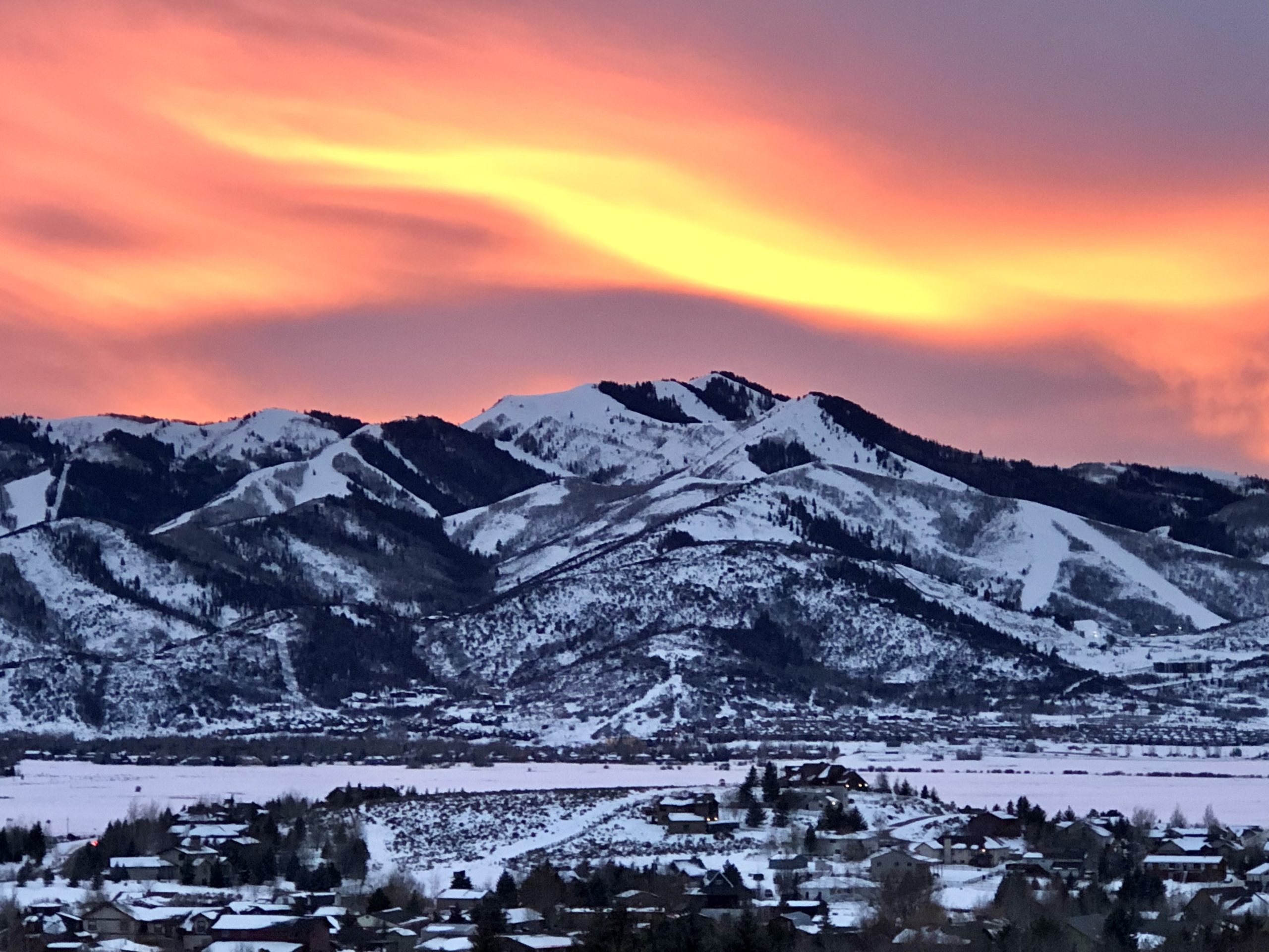 Under sunset clouds in the shape of a luge slider, Park City's Utah Olympic Park, the host of the 2022 FIL Luge Nations Cup and World Cup.