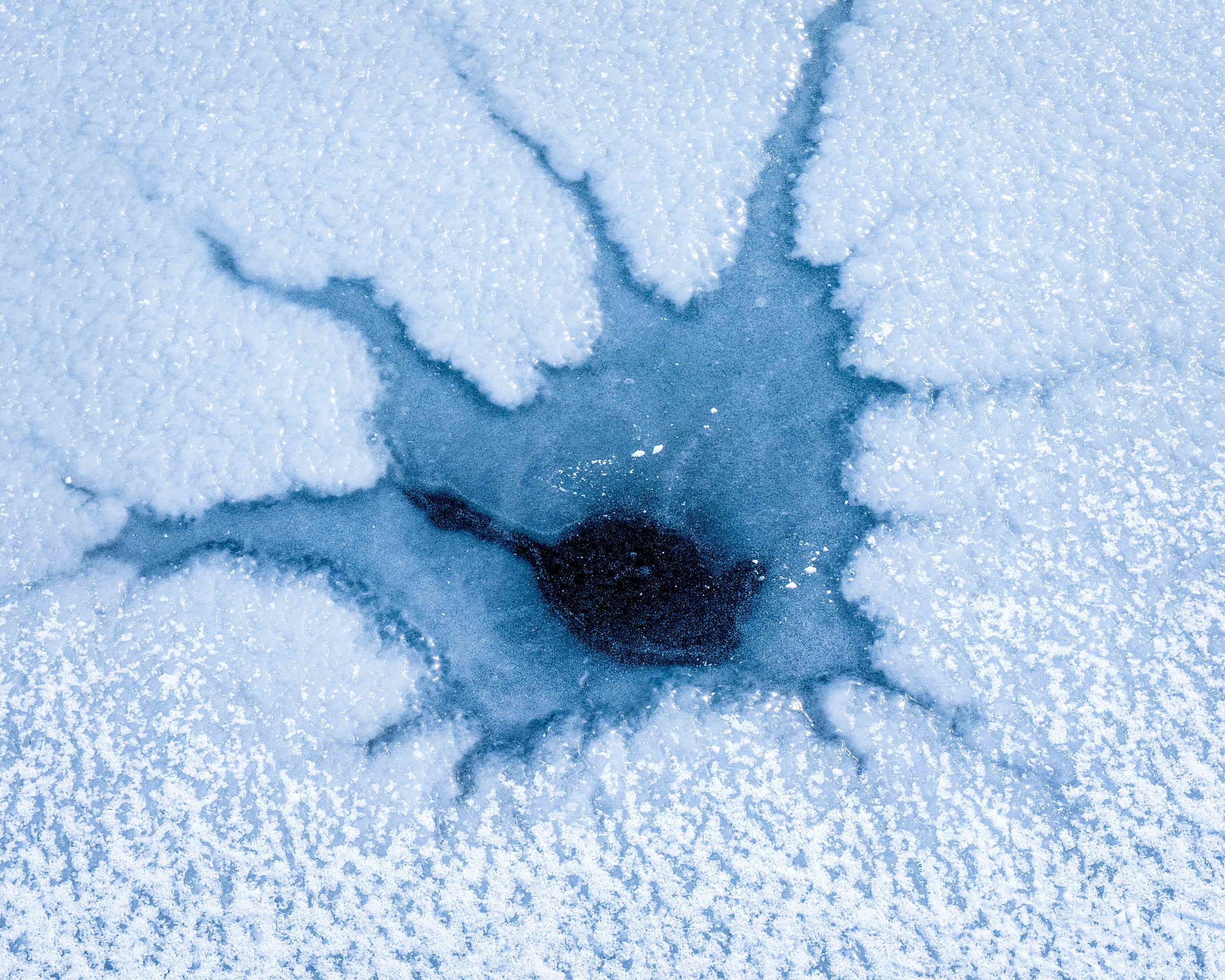 Frozen cracks branching off at Little Dell Reservoir.