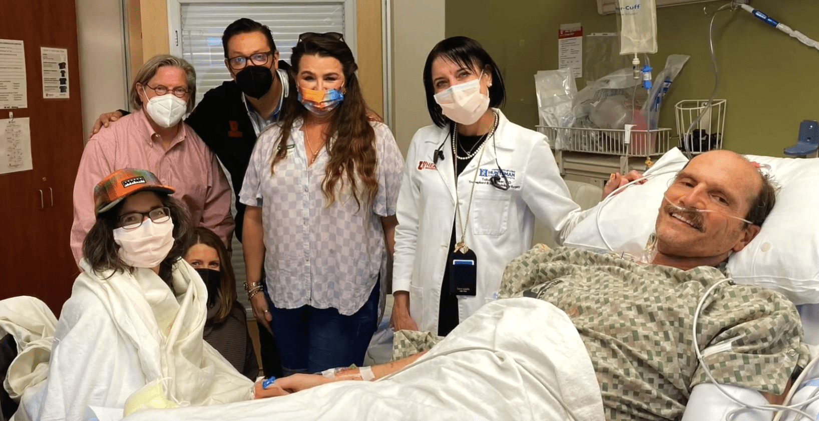 Double donor Laura Diaz Moore, in the baseball cap, and her doctors, family and recipient at the University of Utah Health.