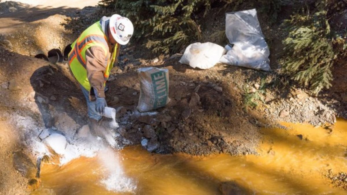 As water exits the mine, it flows into a system of four treatment ponds. The treatment ponds provide retention time to allow the pH to adjust. Here, lime is added to a settling pond to assist in the pH adjustment of the water prior to discharge to Cement Creek on Aug 14, 2015.