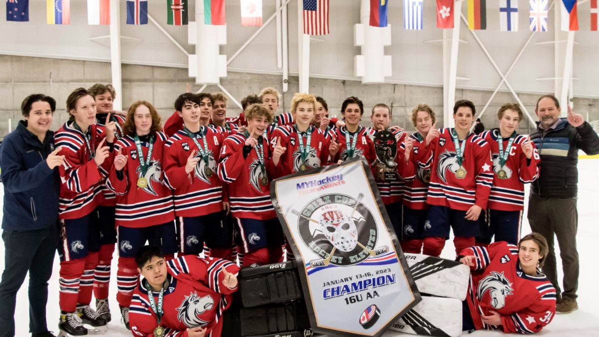 The Grizz Cup Champion Ogden Jr. Mustangs, with some students of the Park City High School.