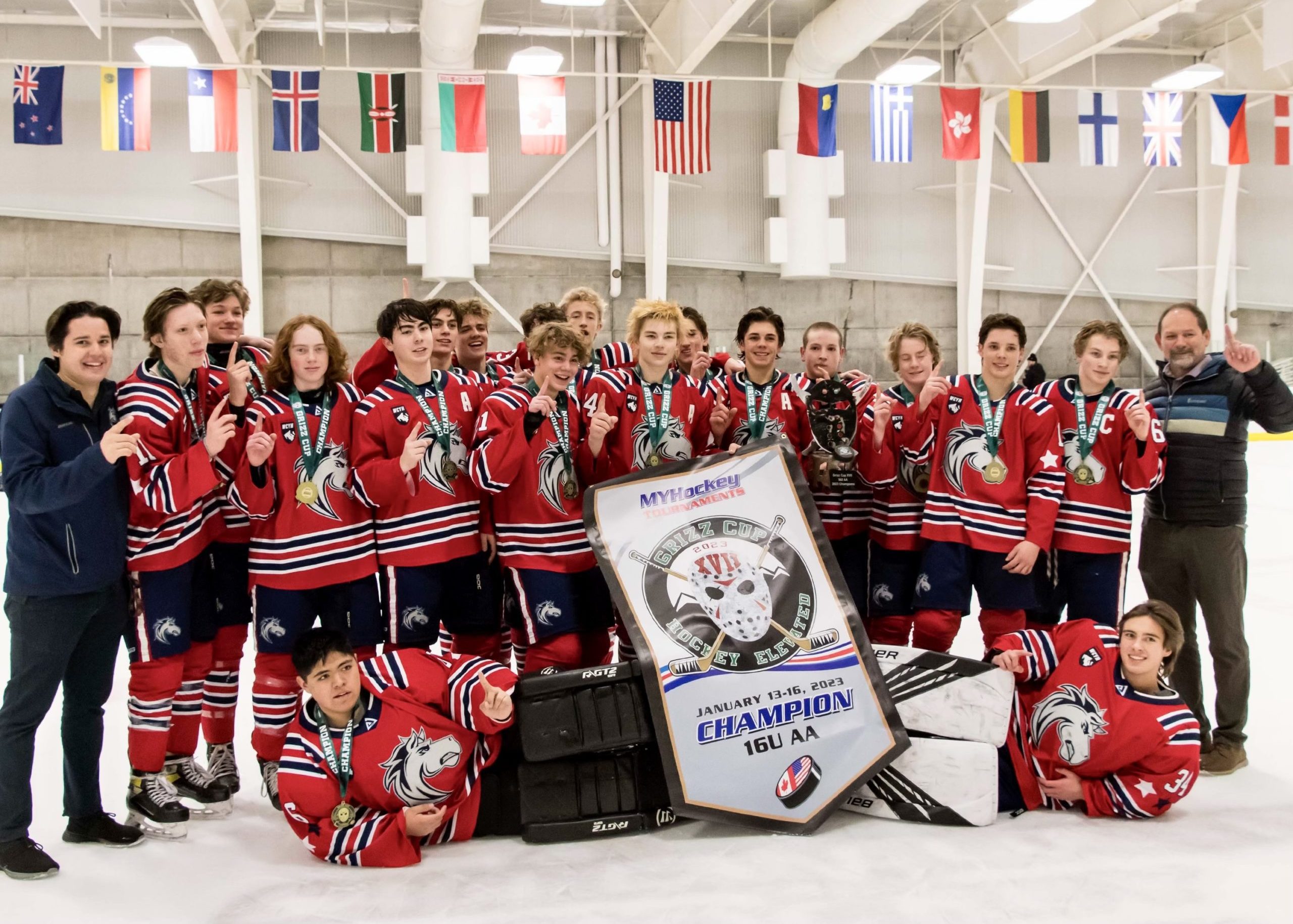 The Grizz Cup Champion Ogden Jr. Mustangs, with some students of the Park City High School.