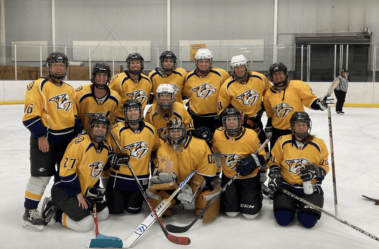 Women's hockey's Park City Predators in a photo from a tournament in December where they ended up on the podium in third.