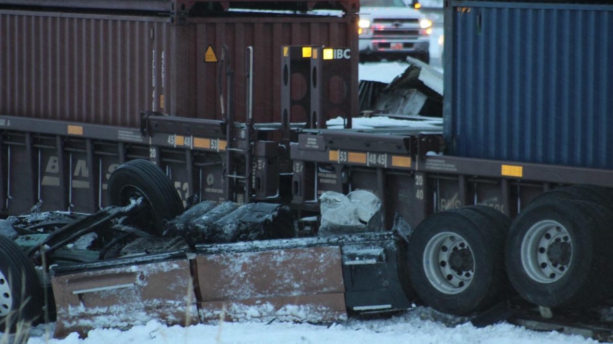 Semi after being struck by a train in Echo Canyon / I-80