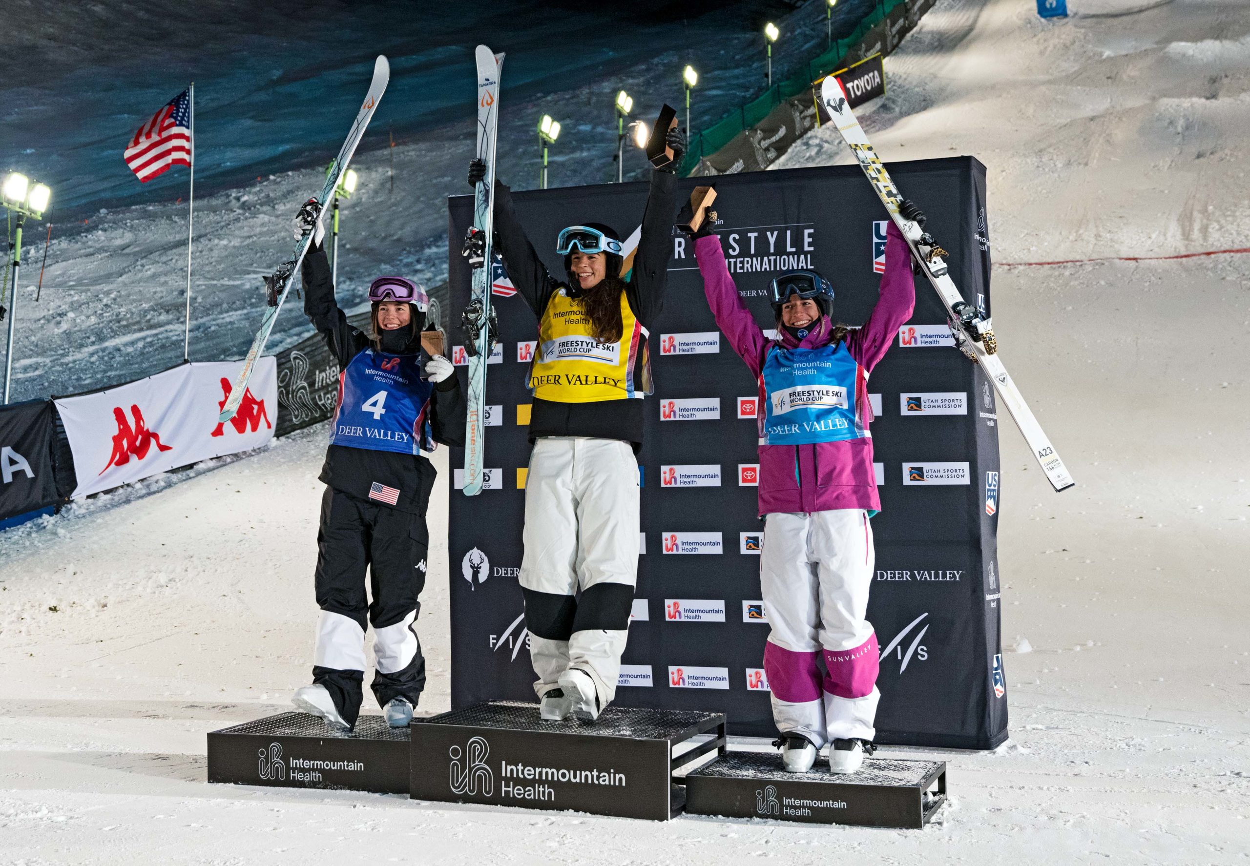 Podium shot showing the top three women's moguls competitors. Pictured from Left to Right: 2nd Place Jaelin Kauf, 1st place Jakara Anthony and 3rd place Perrine Laffont.