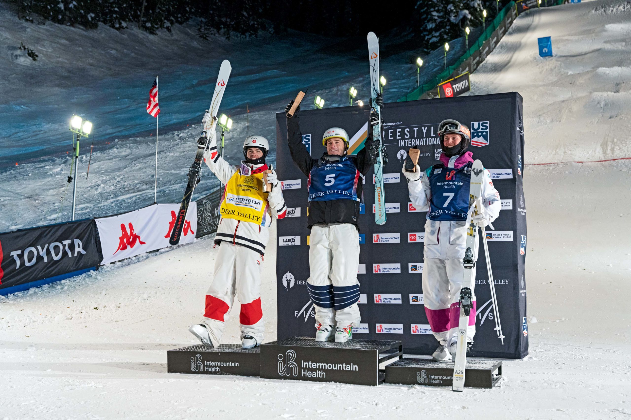 Men's Moguls podium showing the top three of the day. From Left to Right: Mikael Kingsbury 2nd, Matt Graham 1st and Benjamin Cavet 3rd.