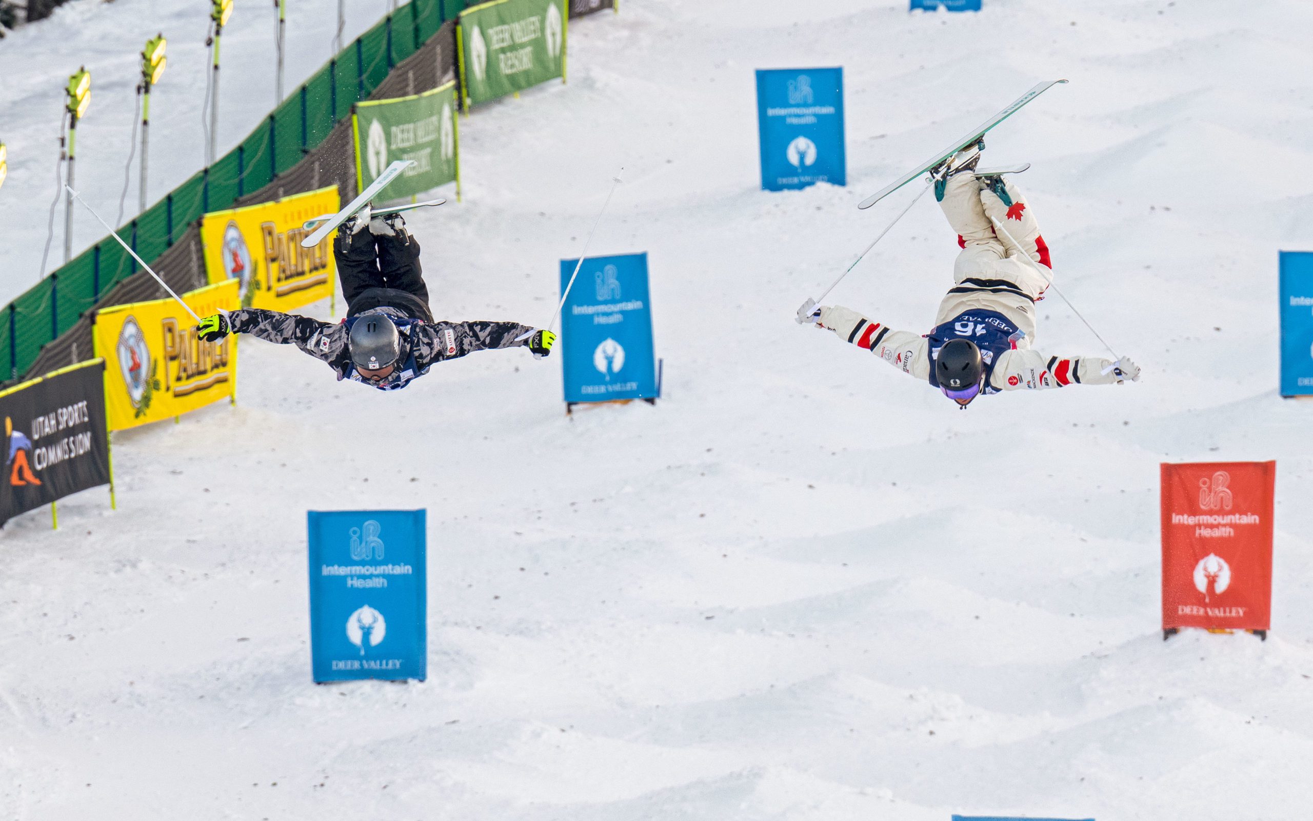 Daeyoon Jung of South Korea and Julien Viel of France in a qualifier dual moguls run.