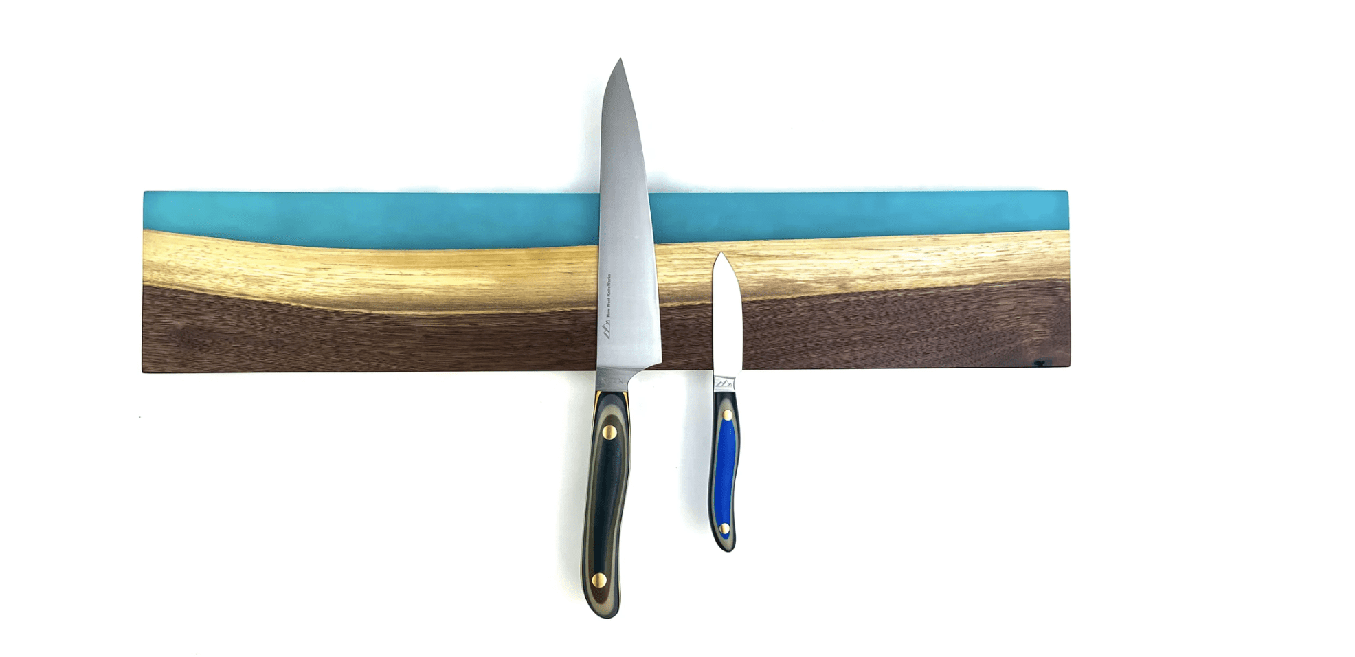 The White Rim resin knife magnet is crafted from walnut wood and aqua resin.