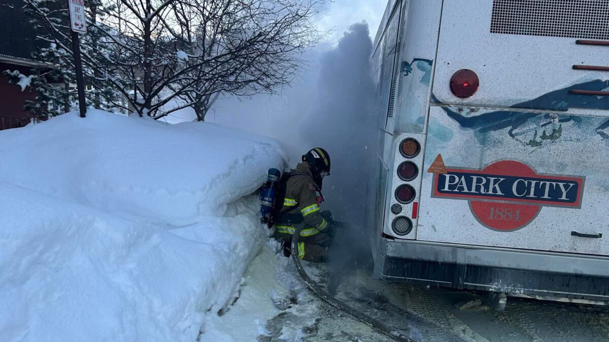 PCFD fire fighter at the scene of a Park City Transit bus on fire.