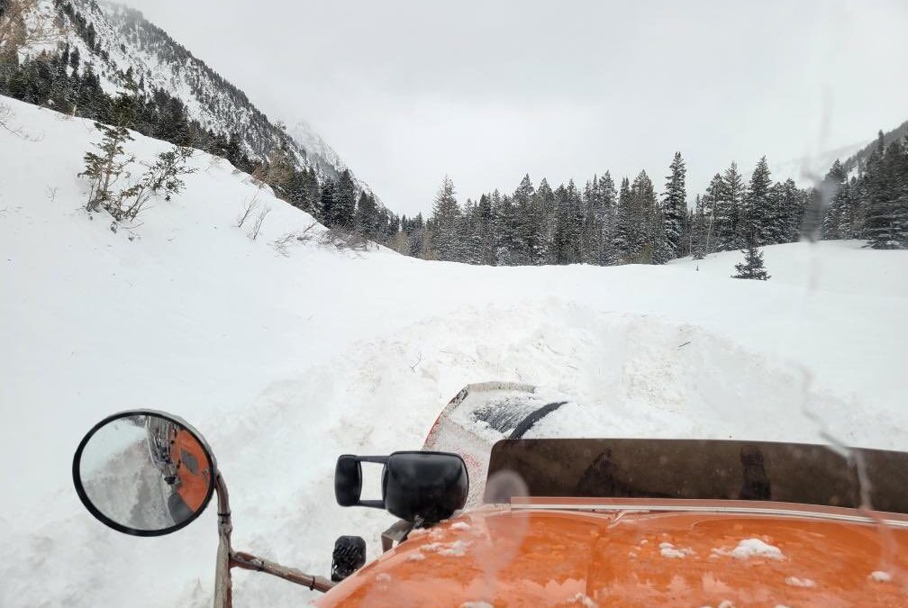 A UDOT snowplow trying to clear SR210 in Little Cottonwood Canyon.