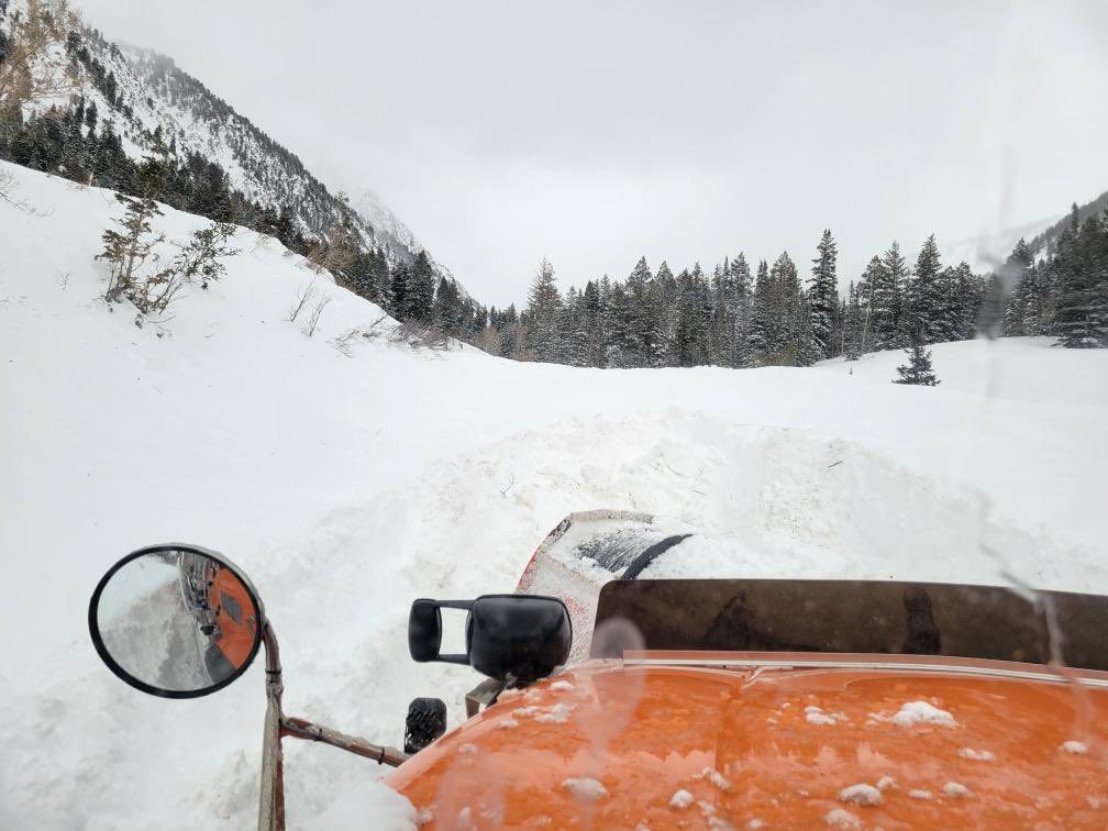 A UDOT snowplow trying to clear SR210 in Little Cottonwood Canyon.