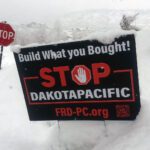 A "Stop Dakota Pacific" yard sign placed in a Park City neighborhood.