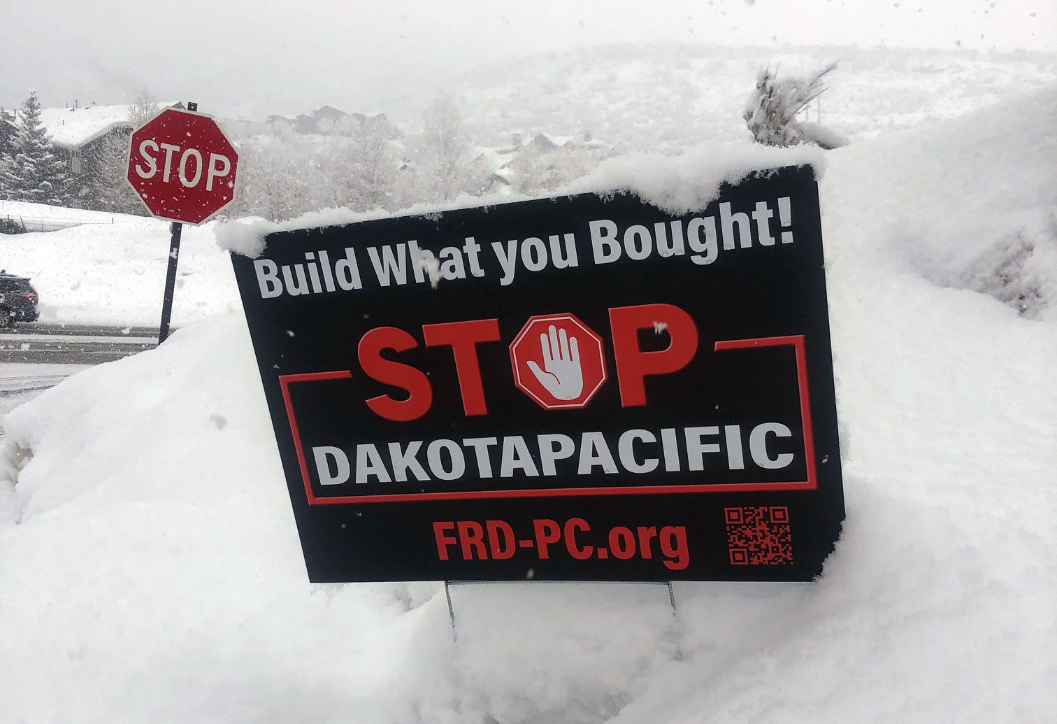 A "Stop Dakota Pacific" yard sign placed in a Park City neighborhood.