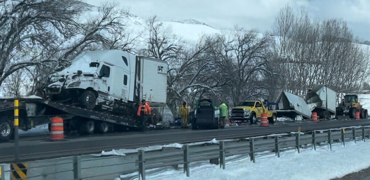 Semi truck cut into three pieces after being removed from a creek near the Weber River