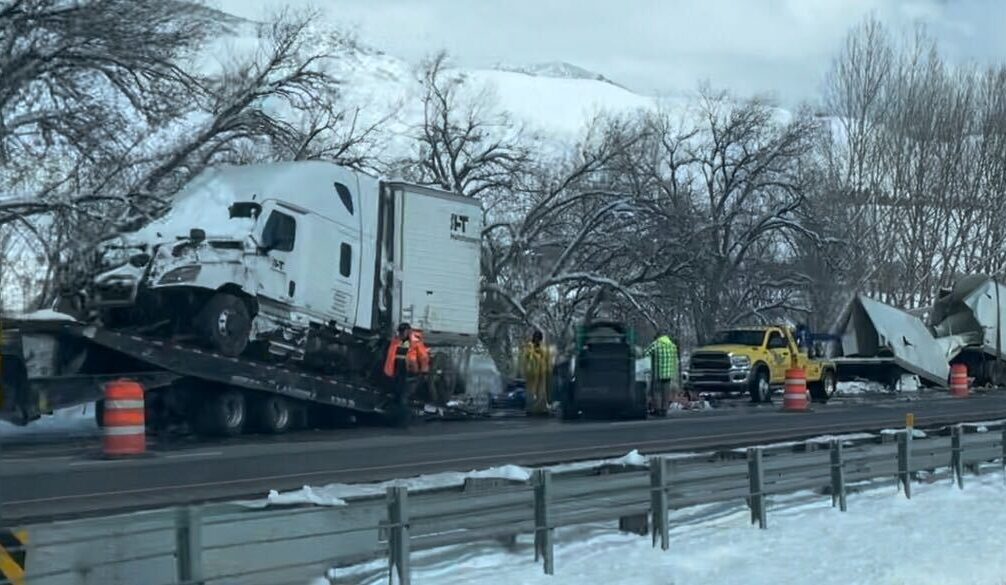 Semi truck cut into three pieces after being removed from a creek near the Weber River