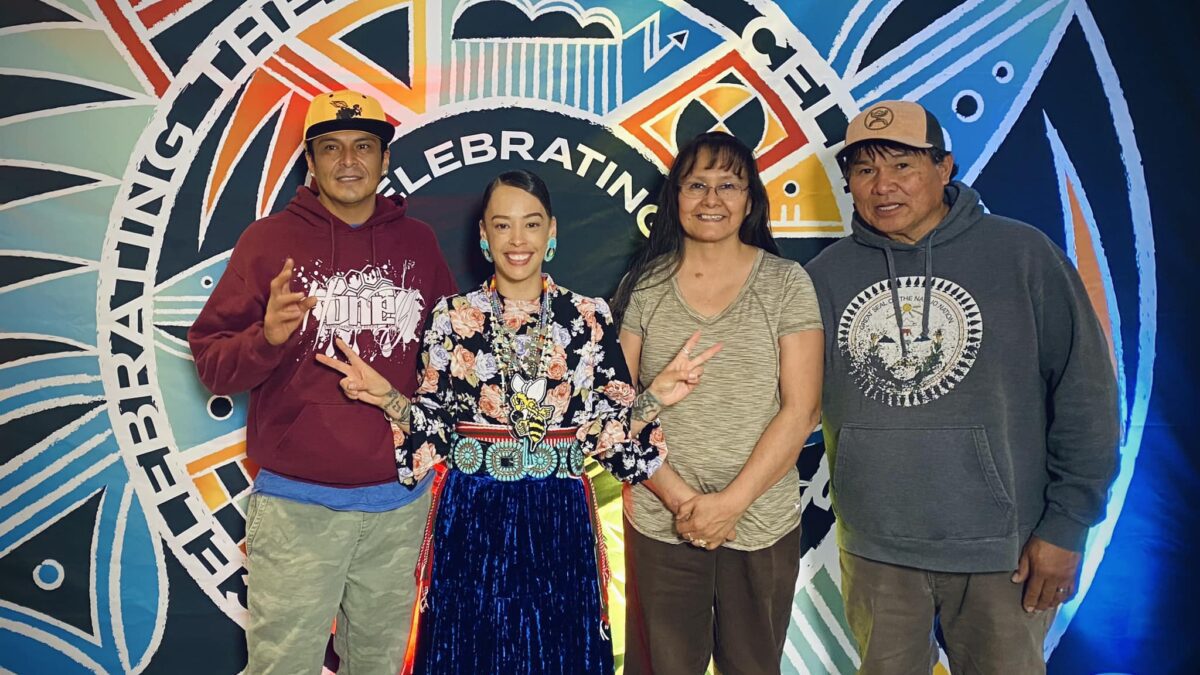 Honey, a member of the Navajo Nation (second from left), performed the National Anthem in her native language and dress at Utah Jazz game on April 6, 2023. Honey captioned this photo "these three people push me to my limits, they love me and care for me, they protect me and keep me shielded these three are my backbone and my strength."