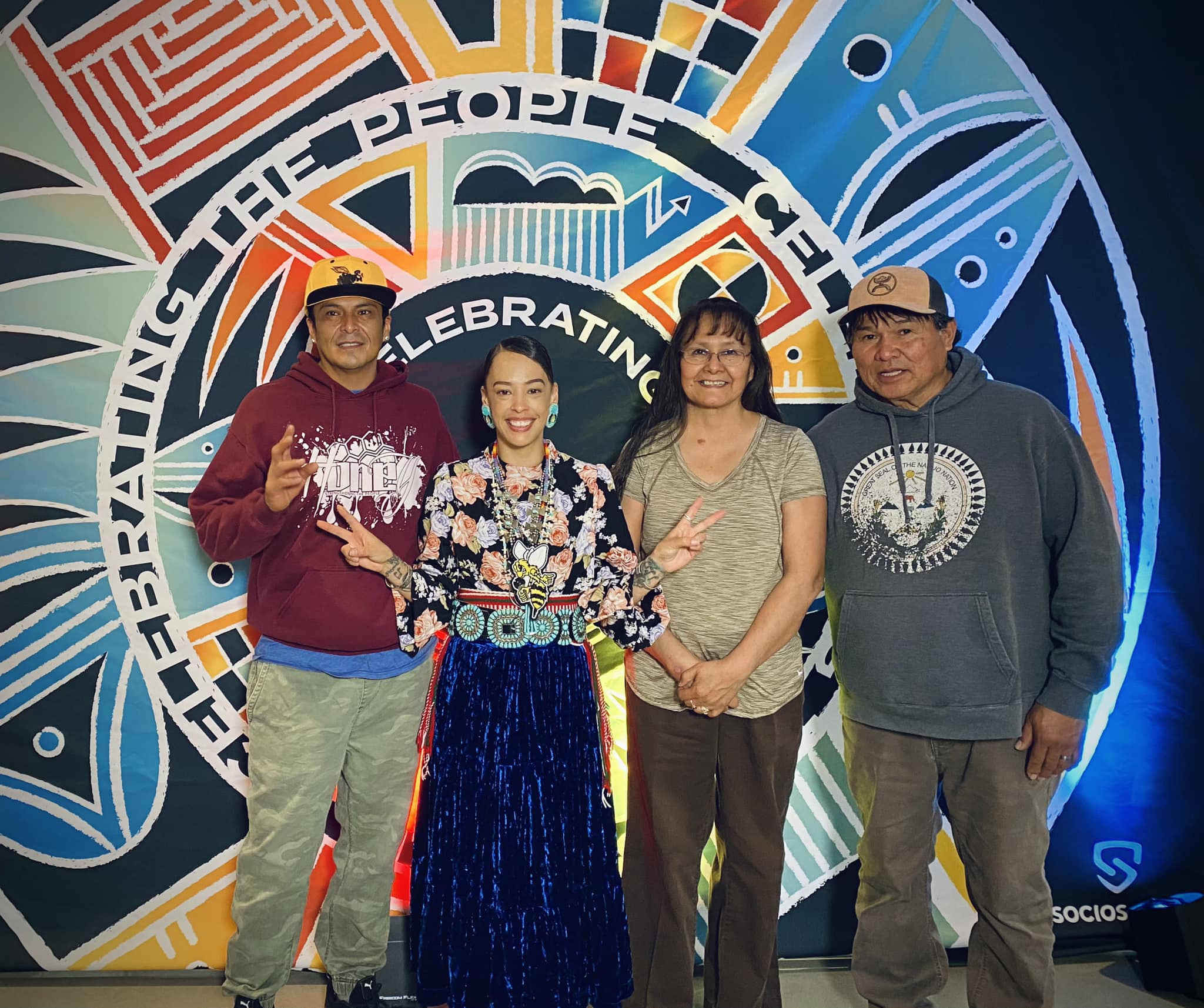 Honey, a member of the Navajo Nation (second from left), performed the National Anthem in her native language and dress at Utah Jazz game on April 6, 2023. Honey captioned this photo "these three people push me to my limits, they love me and care for me, they protect me and keep me shielded these three are my backbone and my strength."