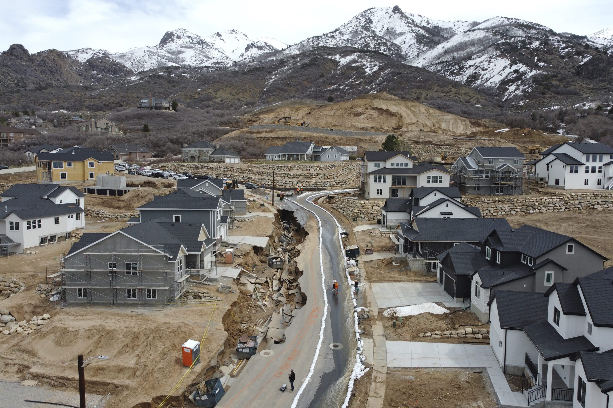 Local officials issued evacuation orders for at least 20 homes as temperatures spiked and snowmelt coursed through the streets on Wednesday, April 12, 2023, in Kaysville, Utah. A record-breaking snow season has raised fears of spring flooding throughout Utah as the weather in mountain regions warms.