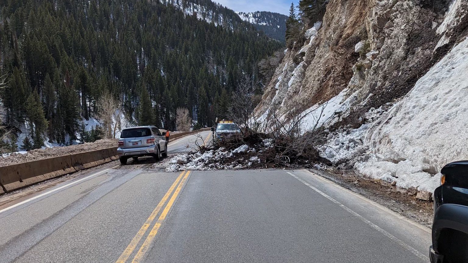 Wet slide debris covers the majority of SR 190 at MP 9.8 near Laurel Pines.