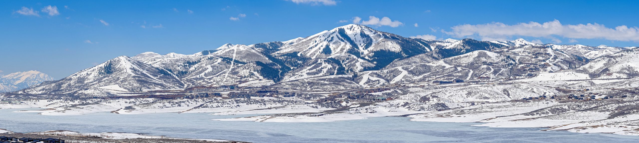 Panorama of Jordanelle Reservoir with Deer Valley Resort in the distance.