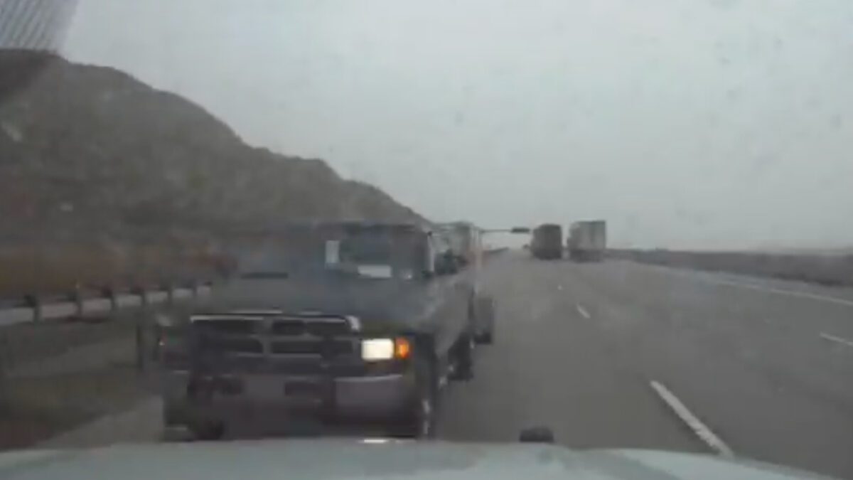 UHP Sergeant put his vehicle in front of a truck pulling a Uhaul trailer that was driving the wrong way on a highway.