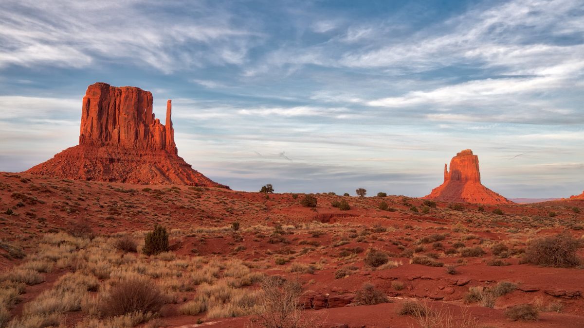 The shadow of the West Mitten butte falls perfectly onto the East Mitten butte in Monument Valley Navajo Tribal Park, Arizona.