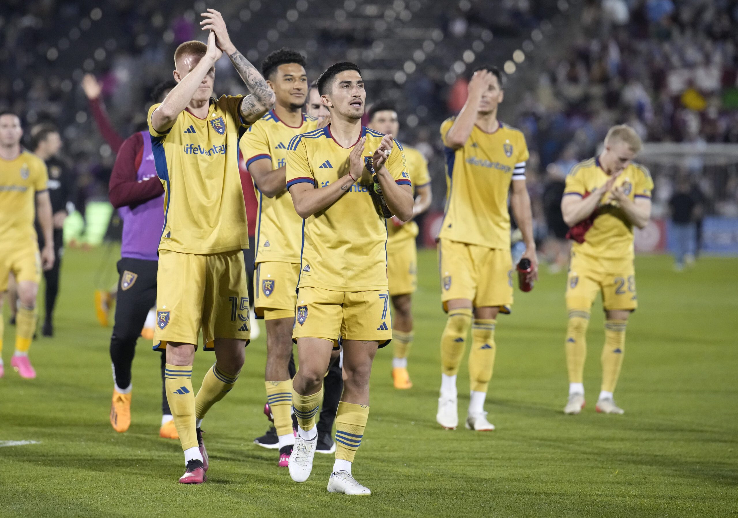 Real Salt Lake midfielder Pablo Ruiz, front, leads teammates to acknowledge the team's fans after the second half of an MLS soccer match against the Colorado Rapids Saturday, May 20, 2023, in Commerce City, Colo.