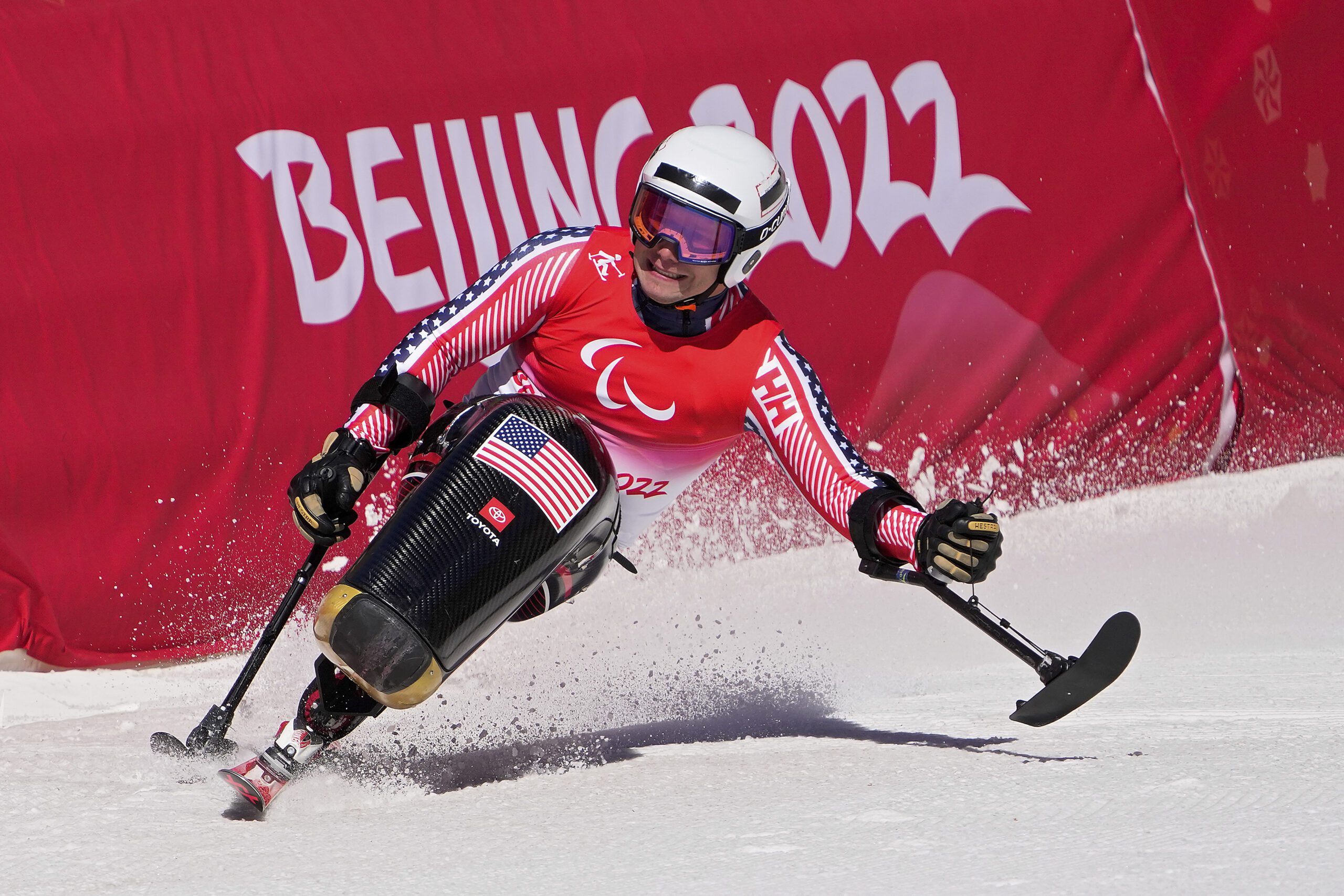 Andrew Kurka of the United States competes in the men's downhill, sitting, at the 2022 Winter Paralympics, March 5, 2022, in the Yanqing district of Beijing. U.S. Ski & Snowboard will add the Paralympic Alpine skiing and snowboard teams back under its umbrella.