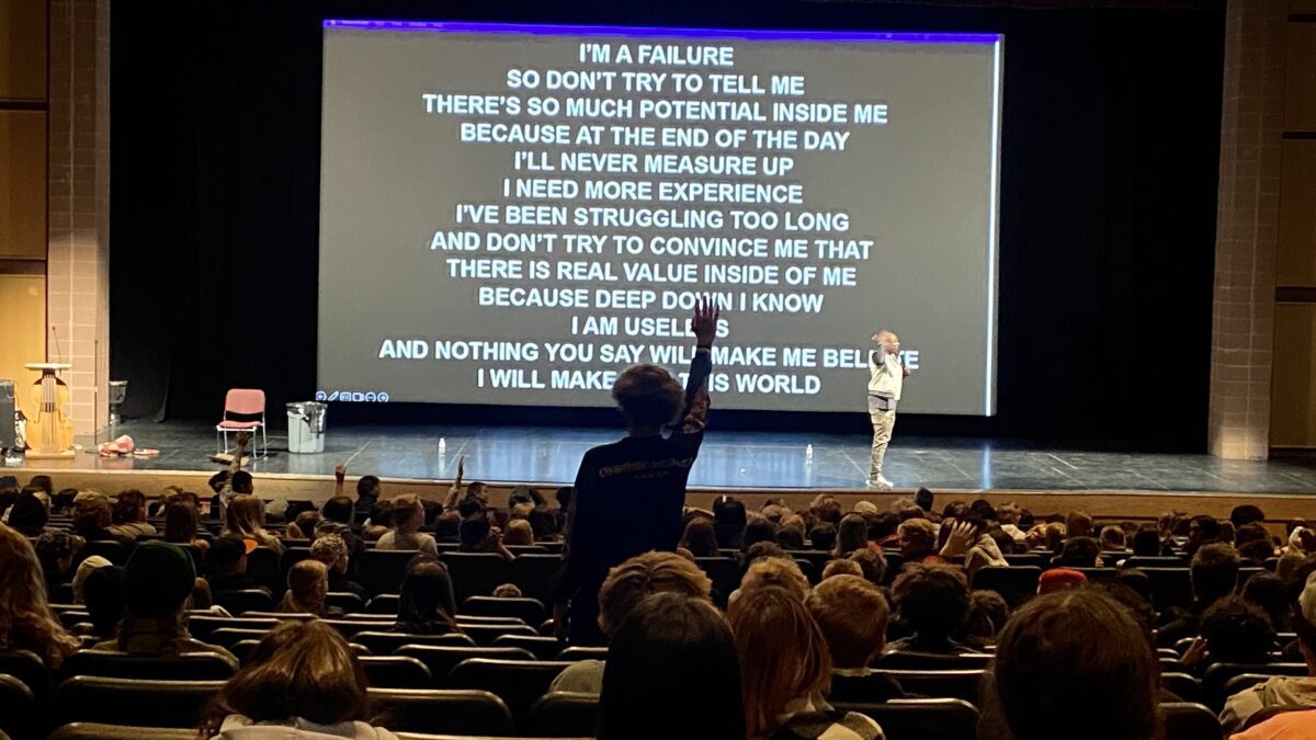"This time read it from the bottom line up to the top line," Boye told the junior high students after they had already read the screen from top to bottom. This, at the high school's Eccles Theater conducted by Alex Boye in an assembly about positive thinking.