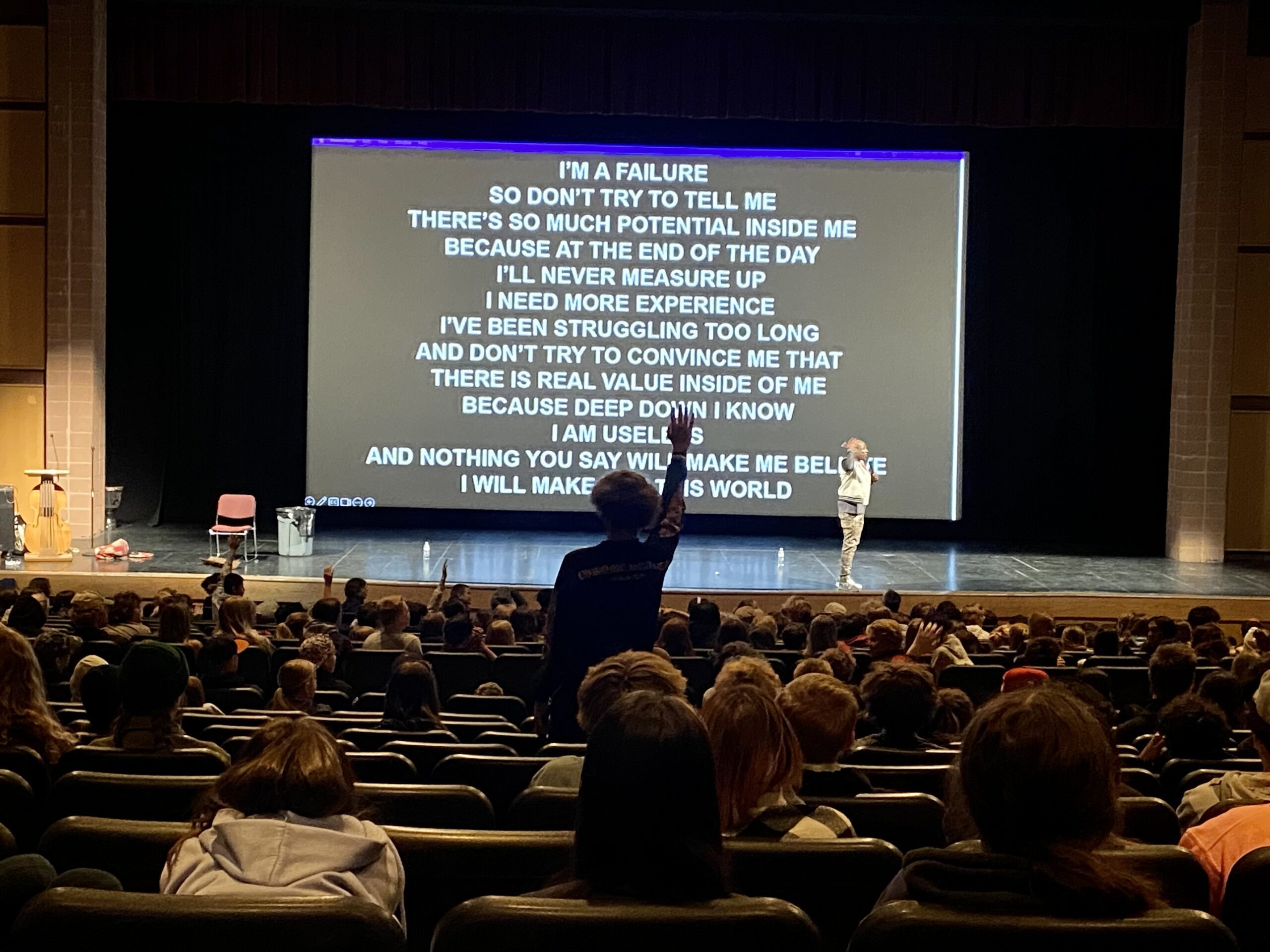 "This time read it from the bottom line up to the top line," Boye told the junior high students after they had already read the screen from top to bottom. This, at the high school's Eccles Theater conducted by Alex Boye in an assembly about positive thinking.