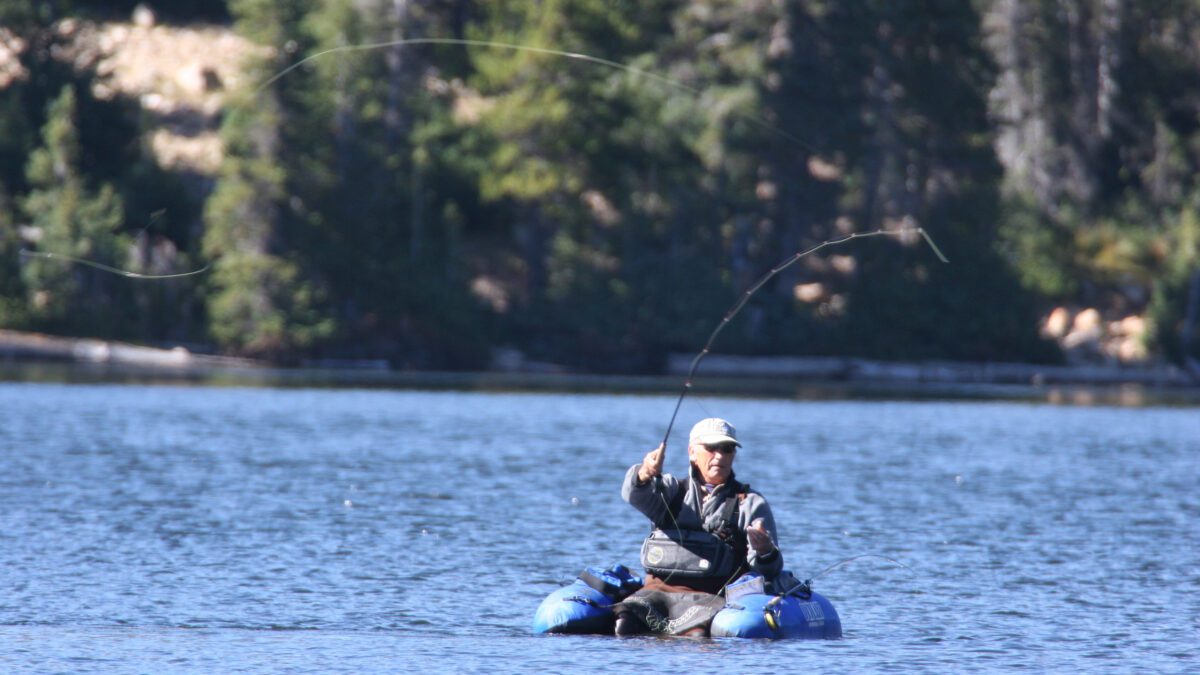 A man fly fishing at Strawberry Reservoir.