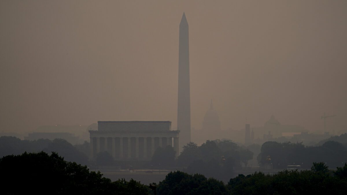 Haze blankets over monuments on the National Mall in Washington, Wednesday, June 7, 2023, as seen from Arlington, Va.