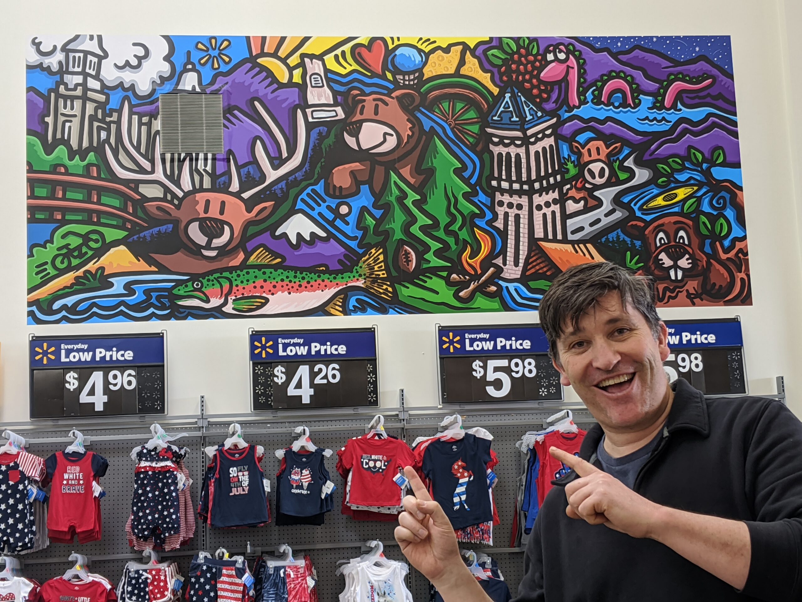 Graphic artist Jason Holladay painted this wall mural on the wall of a Logan Walmart, titled 'My Hometown'.