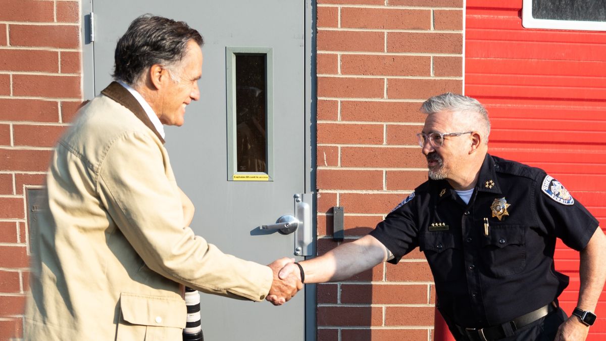 Sen. Mitt Romney shakes hands with Justin Martinez.