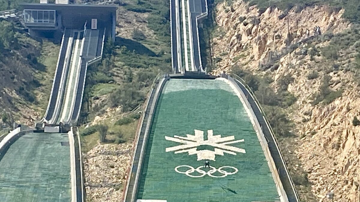 Ski jumper pictured in the center of the Olympic rings during the Springer Tournee at the Utah Olympic Park.