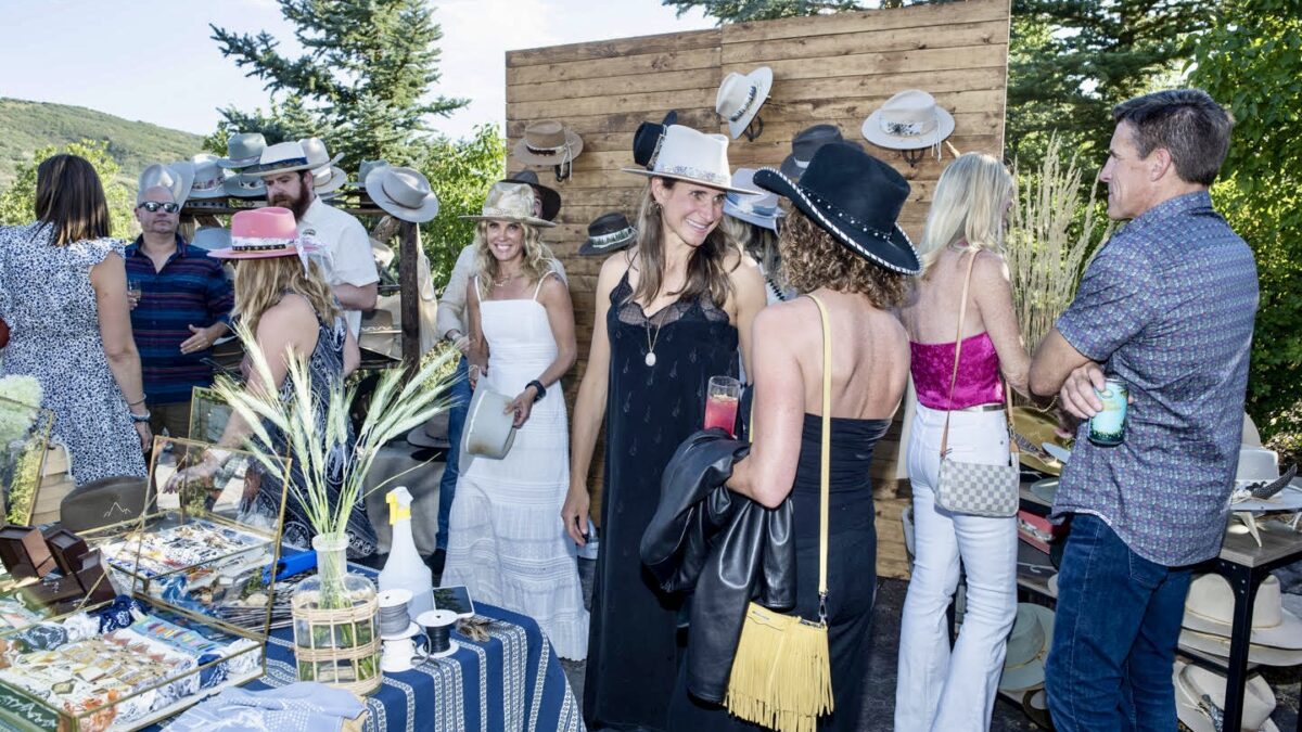 JW Bennett hosts a special pop-up hat fitting experience at the Park City Song Summit's Welcome Dinner benefiting the More Than Music Foundation.