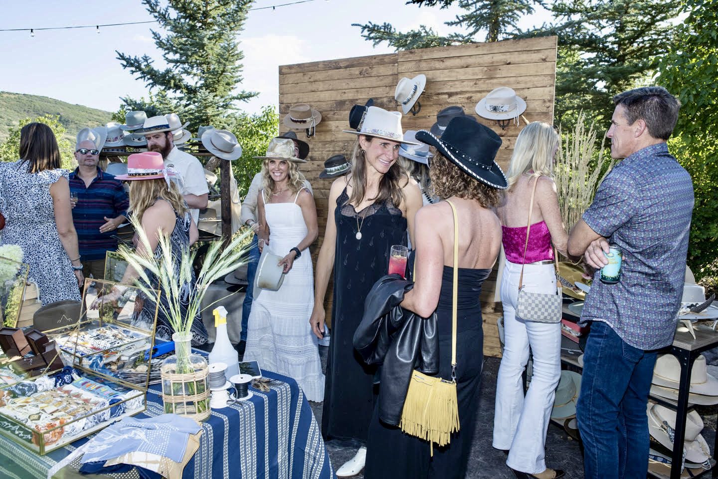 JW Bennett hosts a special pop-up hat fitting experience at the Park City Song Summit's Welcome Dinner benefiting the More Than Music Foundation.