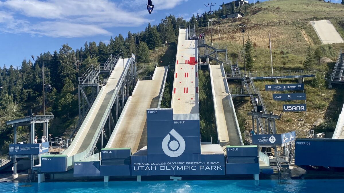 An aerials competitor, upside down, above it all, at the Utah Olympic Park in the FIS Ultimate Airwave.