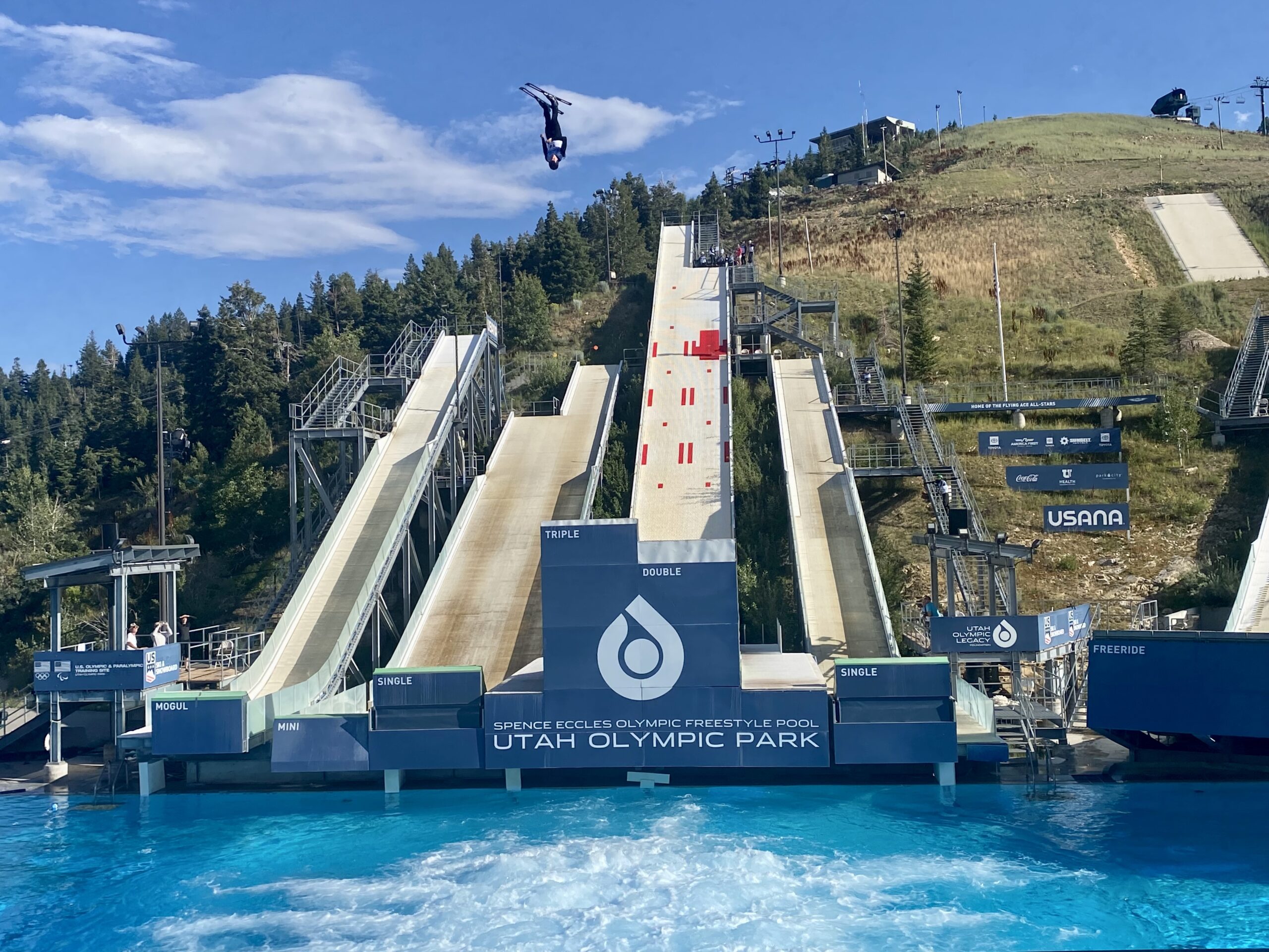 An aerials competitor, upside down, above it all, at the Utah Olympic Park in the FIS Ultimate Airwave.