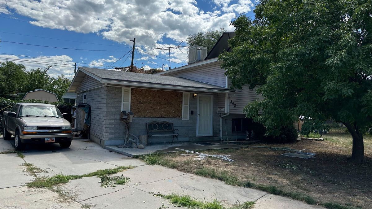 This photo shows a boarded up window and the front of the house of Craig Robertson, who was killed by FBI agents Wednesday during a confrontation after making violent threats against President Joseph Biden and other public officials, Thursday, Aug. 10, 2023 in Provo, Utah.
