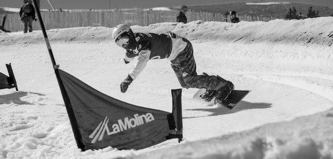 Mike Minor competes in the dual-banked slalom team event at the 2023 Para Snowboard World Championships in La Molina, Spain.