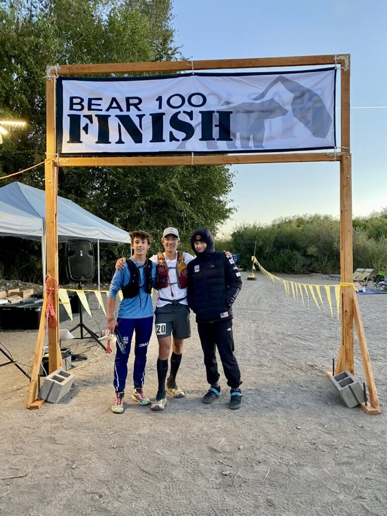 (L - R) Will Berry, his dad Jason Berry, and their friend Tory Hoffman at the Finish Line of Jason's 100 mile race.
