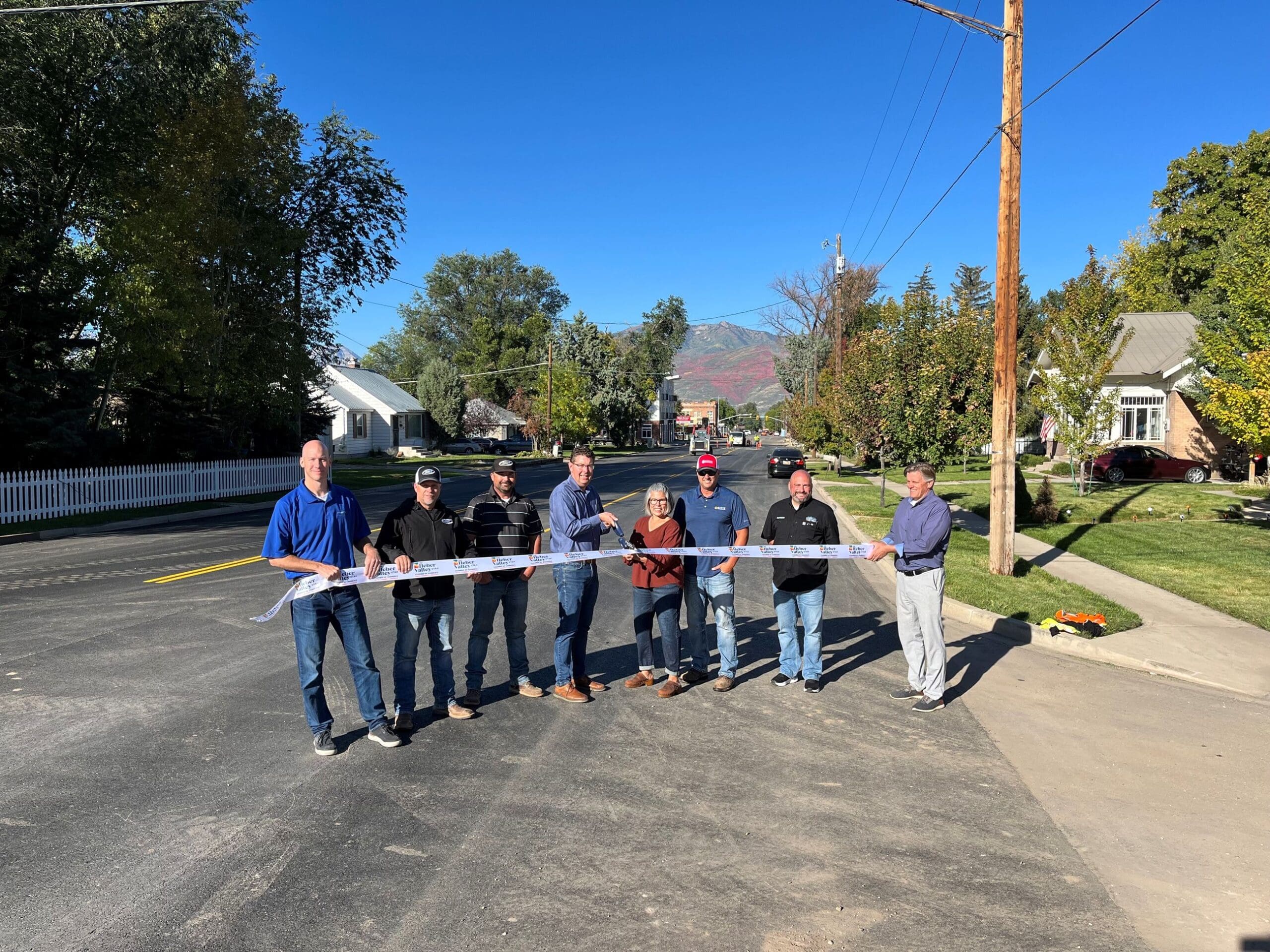 Local leaders and project leads gathered together on the morning of to announce the completion of the road with a ribbon cutting.