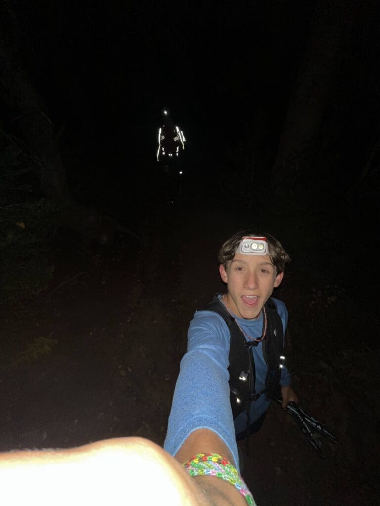 Will taking the photo of himself as a race pacer and his dad Jason in the background on the trail in the middle of the night.
