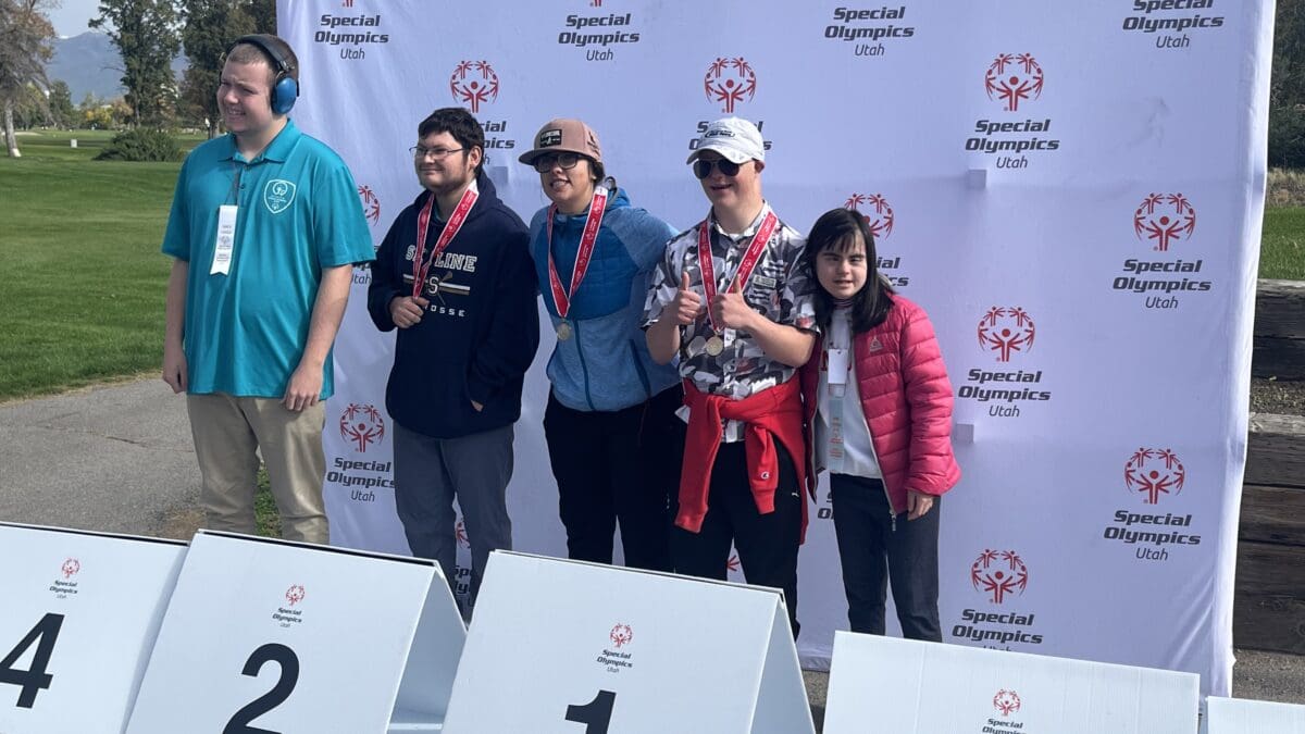 C.J. Haerter in the number one spot after winning gold in golf with Utah Special Olympics.