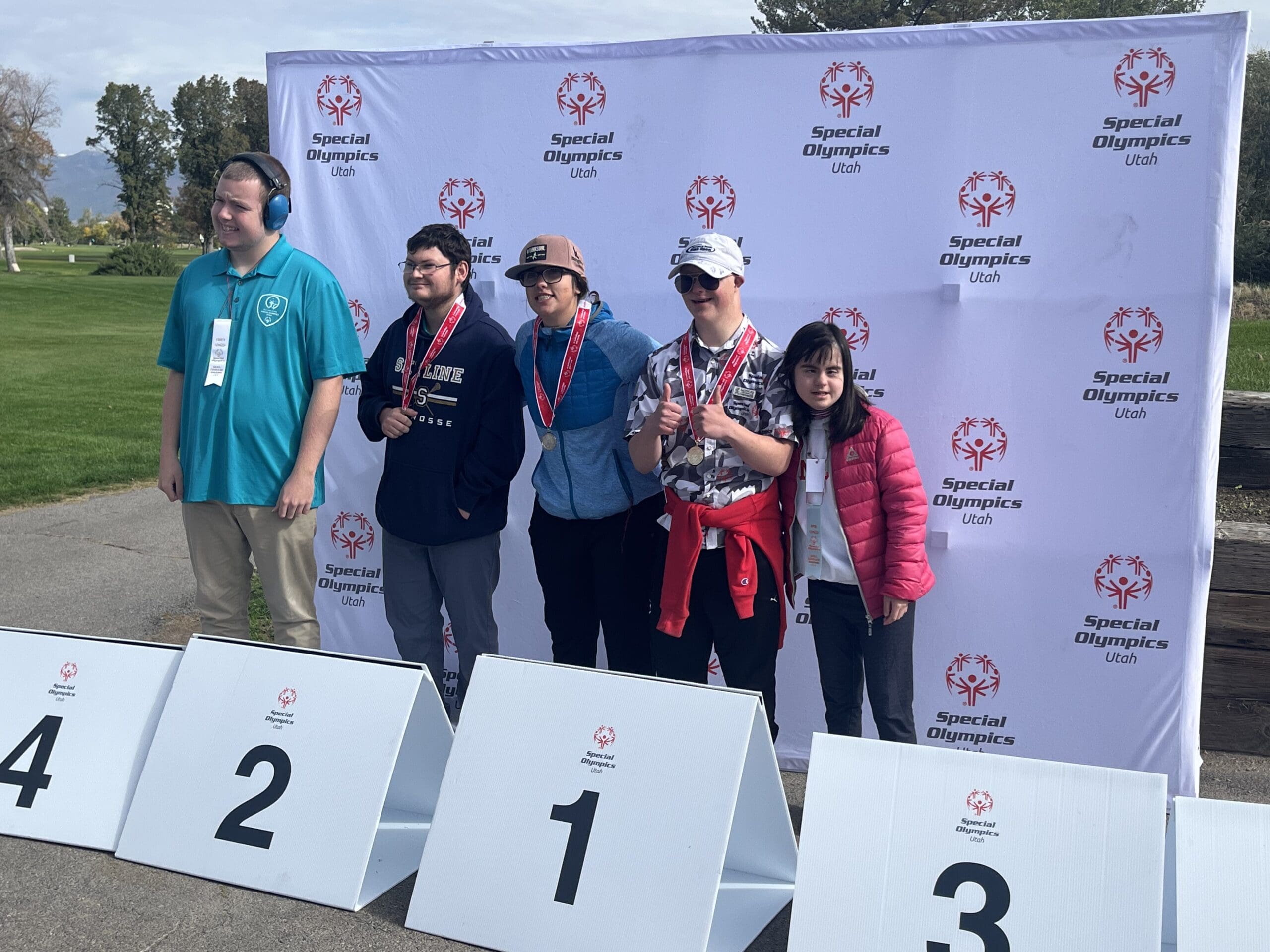 C.J. Haerter in the number one spot after winning gold in golf with Utah Special Olympics.