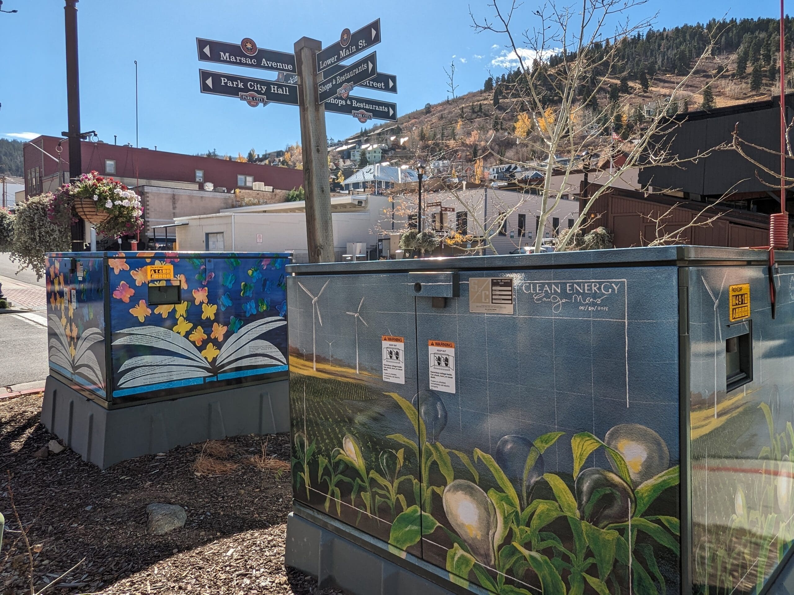 Two of the utility boxes beautified during the 2018 emPOWERment project as seen in October 2023.